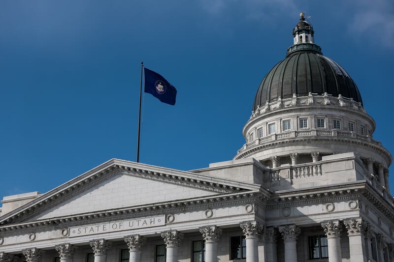 A state flag flutters in the breeze outside of the Capitol in Salt Lake City.