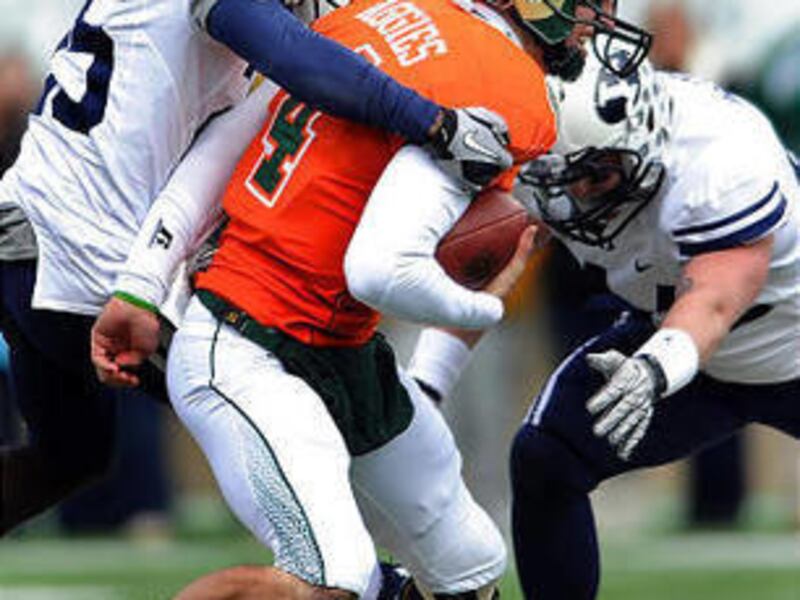 BYU defender Corby Eason, left, sacks Colorado State quarterback Pete Thomas last season. Eason will help in replacing Brian Logan.
