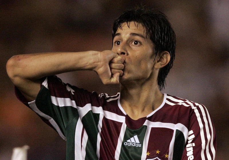 FILE - In this file photo taken Wednesday, June 4, 2008, Brazil's Fluminense's Dario Conca, from Argentina, celebrates after scoring against Argentina's Boca Juniors during a Copa Libertadores soccer semifinal game at the Maracana stadium, in Rio de Janei