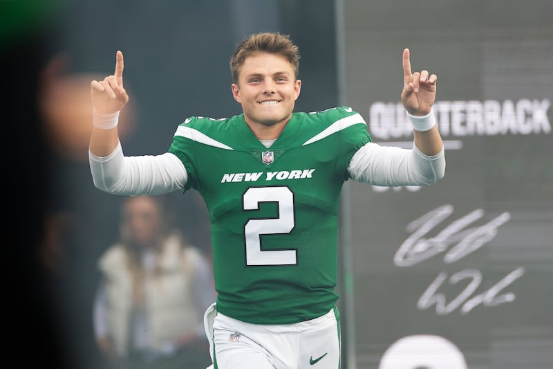 New York Jets quarterback Zach Wilson gestures as he is introduced before an NFL football game against the Philadelphia Eagles, Sunday, Oct. 15, 2023