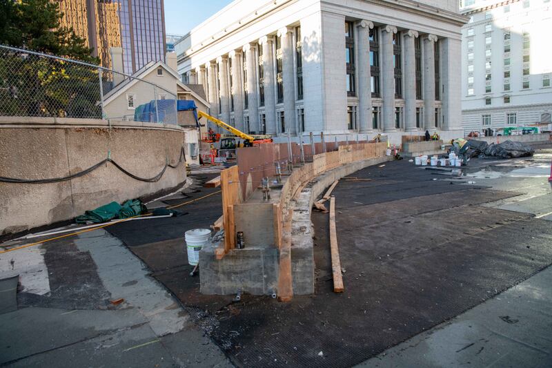 The makings of a new concrete elliptical structure on the southeast side of the Church Office Building plaza where country flags will be displayed.