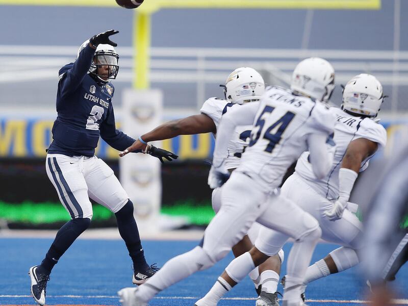 Utah State Aggies quarterback Kent Myers (2) throws during the Idaho Potato Bowl in Boise, Idaho Tuesday, Dec. 22, 2015.