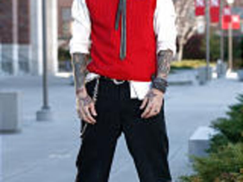 Motley Crue drummer Tommy Lee is decked out in college attire.