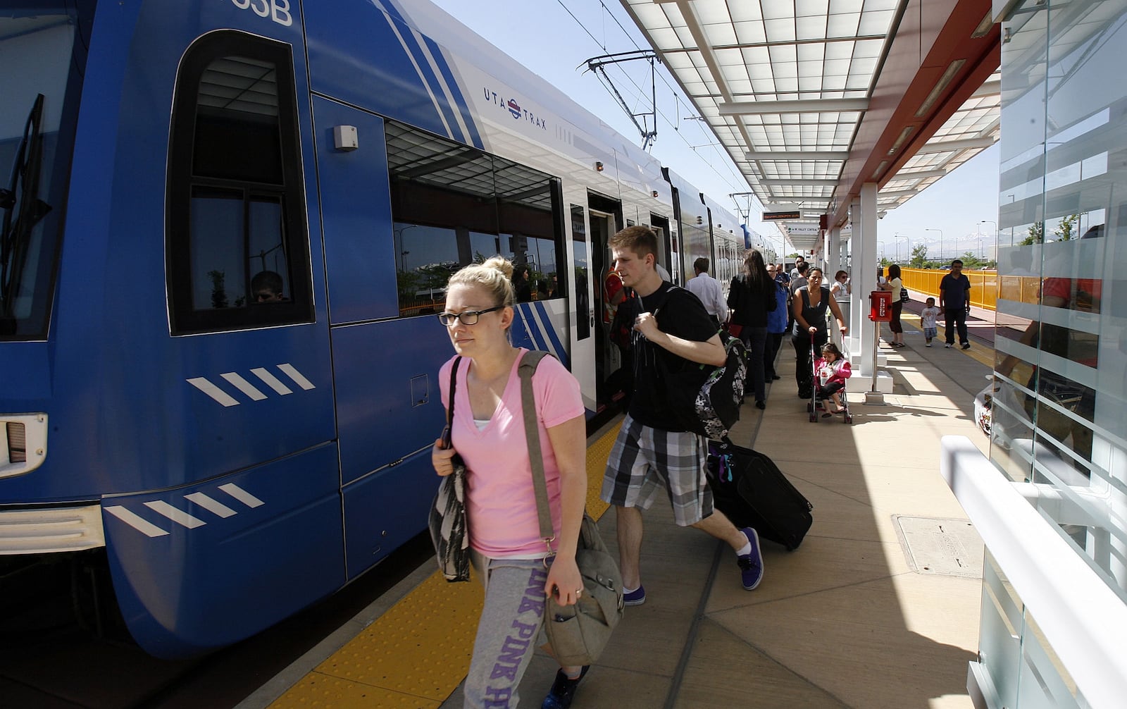 Passengers arrive by TRAX train at the Salt Lake City International Airport on May 13, 2013.