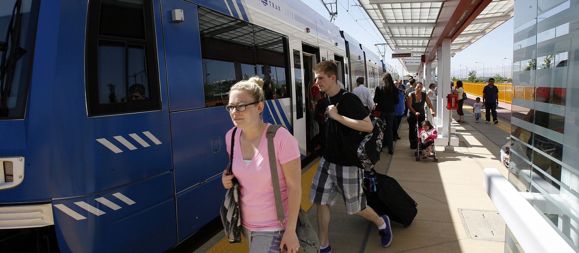 Passengers arrive by TRAX train at the Salt Lake City International Airport on May 13, 2013.