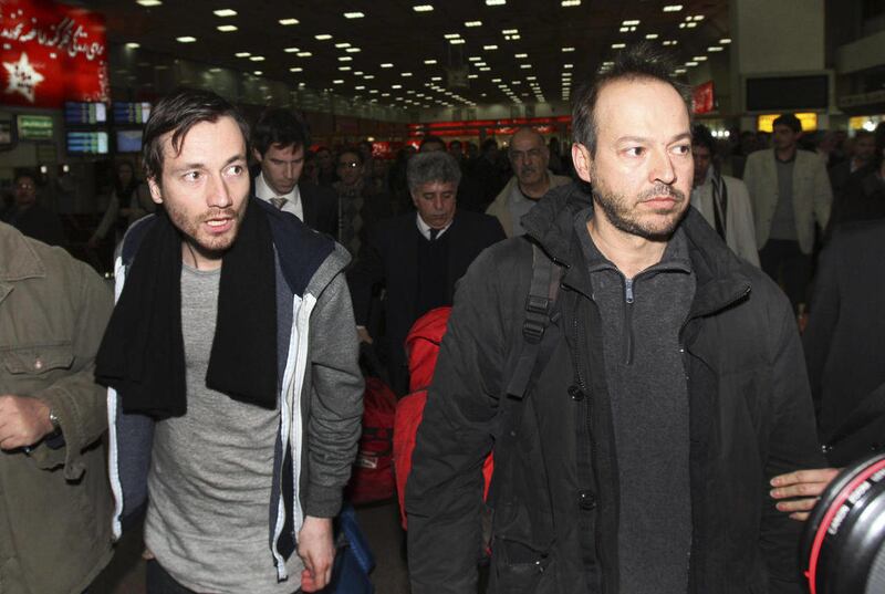 FILE - In this Feb. 19, 2011 file picture German journalists Jens Koch, left, and Marcus Hellwig, arrive at the Mehrabad airport in Tehran, Iran from the northwestern city of Tabriz where they have been jailed. German reporter Marcus Hellwig says he was b