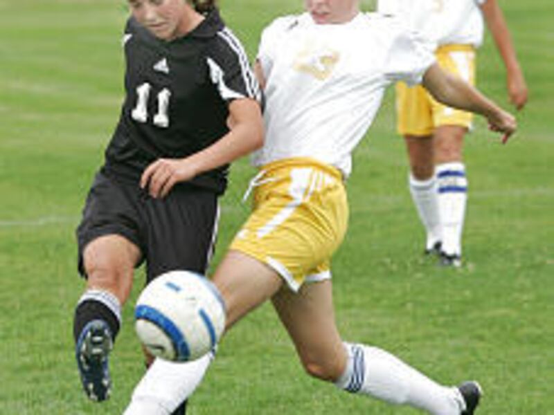 Orem High's Kelsea Park (right) comes in strong to steal the ball from Lone Peak's Mikala Wilkes. The Knights win was its fourth in a row.