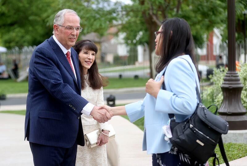 Elder Neil L. Andersen, of the Quorum of the Twelve Apostles, shakes hands with Mayavel Amado.