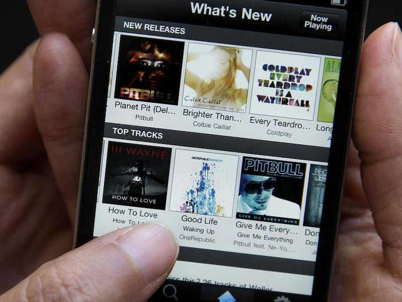 An Associated Press reporter demonstrates Spotify during a product review in San Francisco, Tuesday, July 19, 2011. Spotify is an online streaming music service which made its U.S. debut last week. Forgotify is a new app that gives users the opportunity t