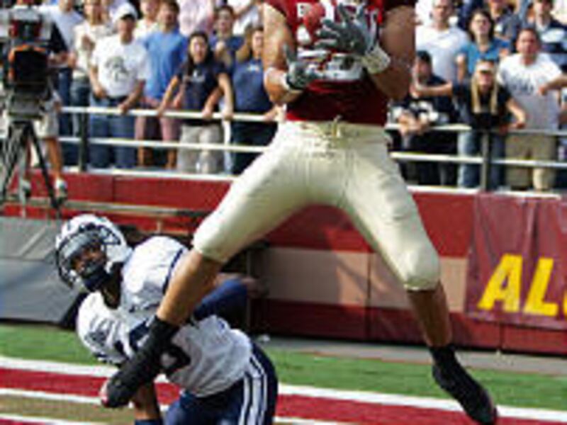 Boston College receiver Tony Gonzalez hauls in game-winning touchdown pass in the second overtime in front of BYU's Justin Robinson.