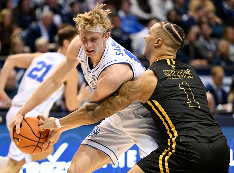 BYU guard Richie Saunders keeps the ball away from Southeastern Louisiana’s Avery Wilson during game in Provo.