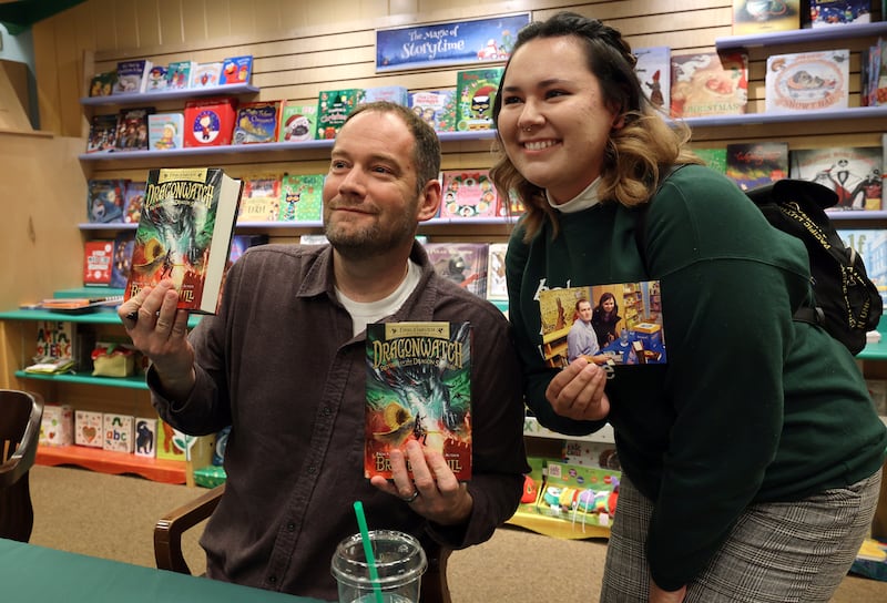 Author Brandon Mull is pictured at a book signing.