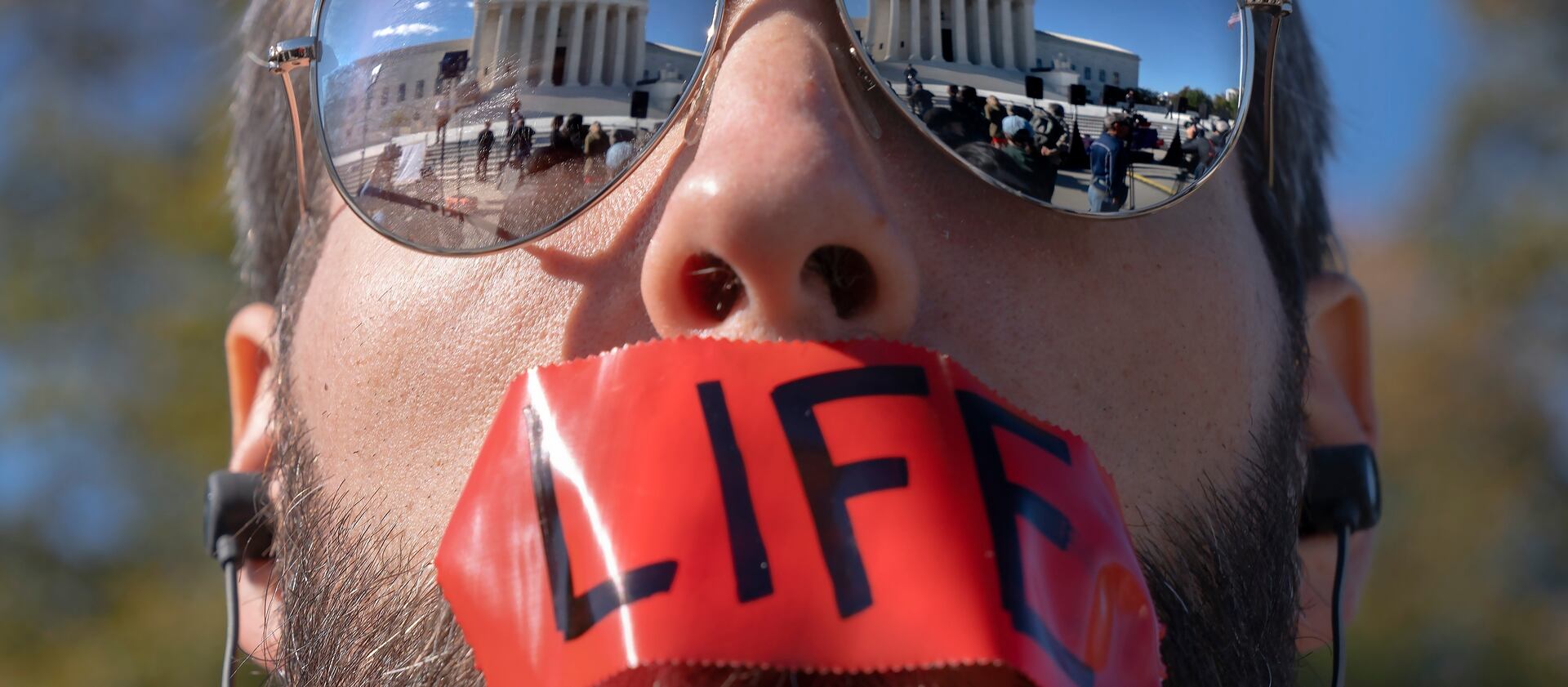 A pro-life activist attends a rally outside the Supreme Court.