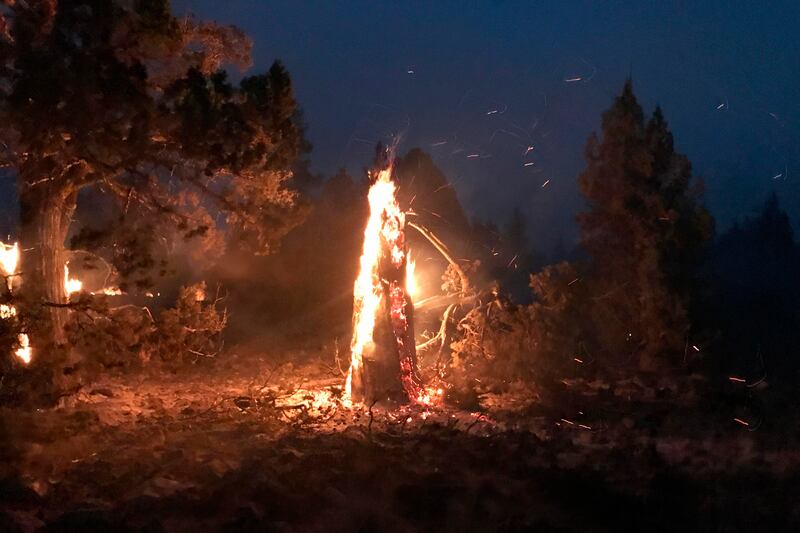 The Bootleg Fire burns at night near Highway 34 in southern Oregon.