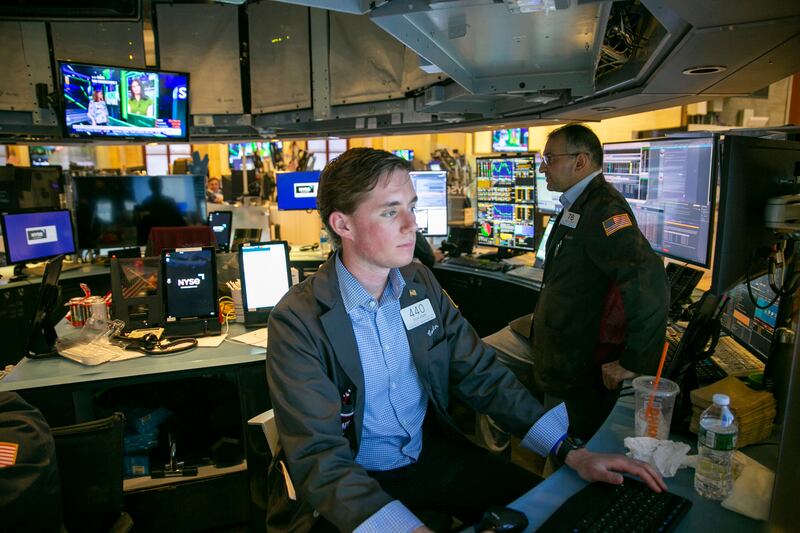 Traders are shown on the floor of the New York Stock Exchange.