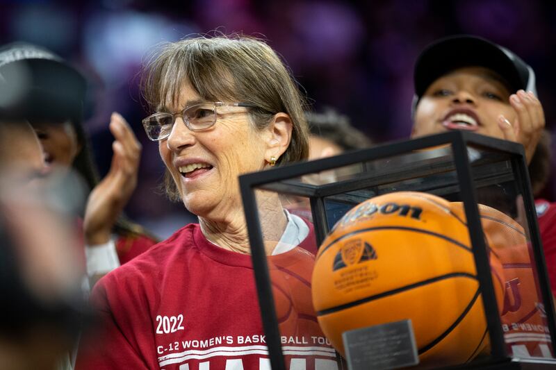 Stanford head coach Tara VanDerveer accepts an award for winning her 1,000th career game.