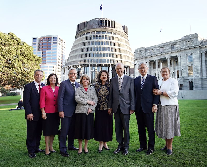President Russell M. Nelson of The Church of Jesus Christ of Latter-day Saints, third from right, stands with his wife, Sister Wendy Nelson, and other general authorities and their wives, for a photo in front of the New Zealand Parliament in Wellington on