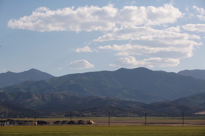The Olympia Hills development was proposed just west of Herriman, beyond the telephone poles in this photo taken from Herriman High School on Thursday, June 14, 2018. Many members of the community are concerned about the high density of the development, w