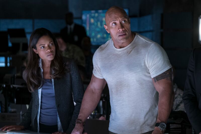 Naomie Harris as Dr. Kate Caldwell and Dwayne Johnson as Davis Okoye in “Rampage.”