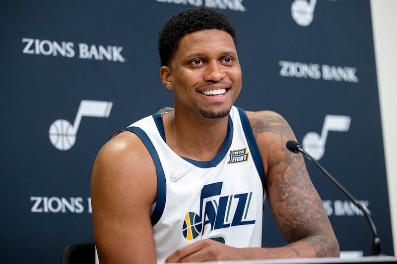 Utah Jazz forward Rudy Gay, wearing a white jersey, smiles
