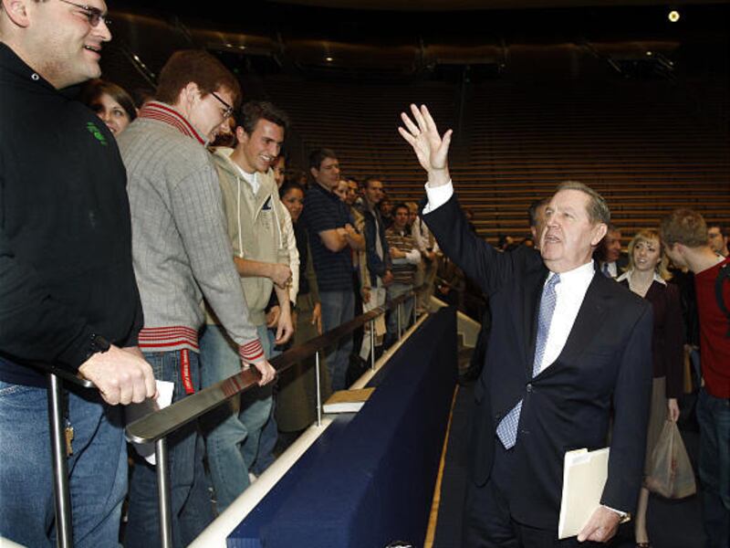 Elder Jeffery R. Holland waves to BYU students at the Marriott Center and tells them he loves them after his talk at Tuesday's devotional, during which he urged students not to dwell on the past.