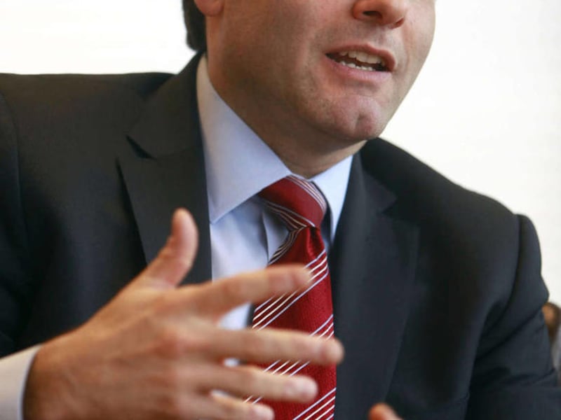 A Friday, March 12, 2010 file photo shows FCC Chairman Julius Genachowski in his office in Washington. Internet news sources lit up early this week after a Washington Post story claimed Sunday that the Federal Communication Commission plans to set up a f