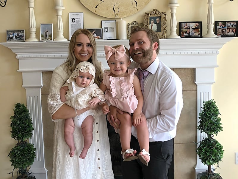Dani and Denny Bates pose with their two daughters. Denny died from suicide in March of this year.