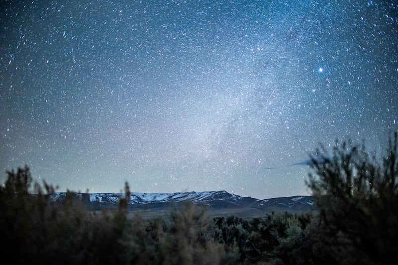 Starlight illuminates the sagebrush and mountains near the site of a proposed lithium mine at Thacker Pass, Nevada.
