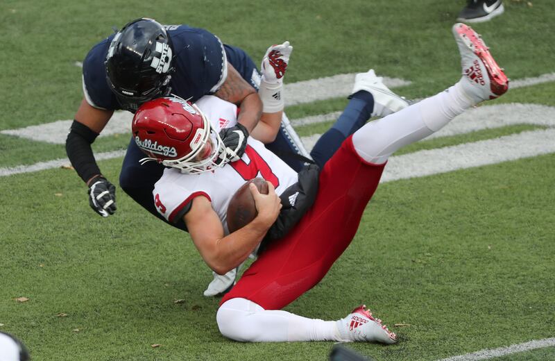 Utah State Aggies linebacker Elijah Shelton (41) sacks Fresno State Bulldogs quarterback Jake Haener (9).