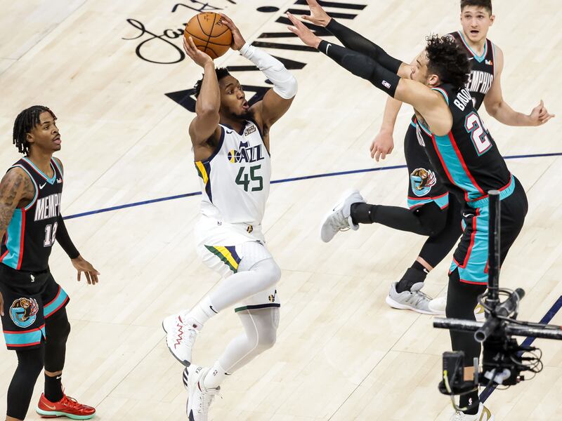 Utah Jazz’s Donovan Mitchell shoots against the Memphis Grizzlies in a 2021 game. Mitchell will be a key factor in the Jazz-Grizzlies playoff series.