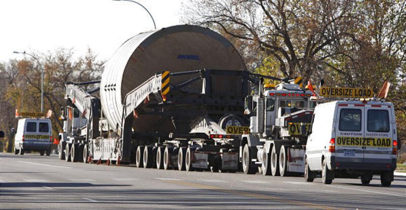 The huge "Yankee Dryer," a piece of equipment going to the Procter & Gamble plant near Corrine, moves through Smithfield at its top speed of about 10 mph. The huge equipment takes a 220-foot-long truck to move it. It left Houston on Oct. 3 bound for Box E