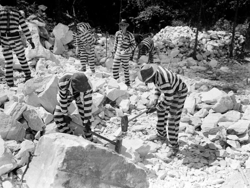 A photo from June 24, 1937, shows convicts sentenced to a chain-gang camp work at a stone quarry in Jasper, Georgia.