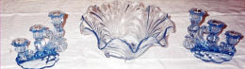 A.A.'s pressed glassware, in a pattern called Caprice, originated in the 1940s and reportedly was made by Cambridge Glass Co. until 1957 or so.