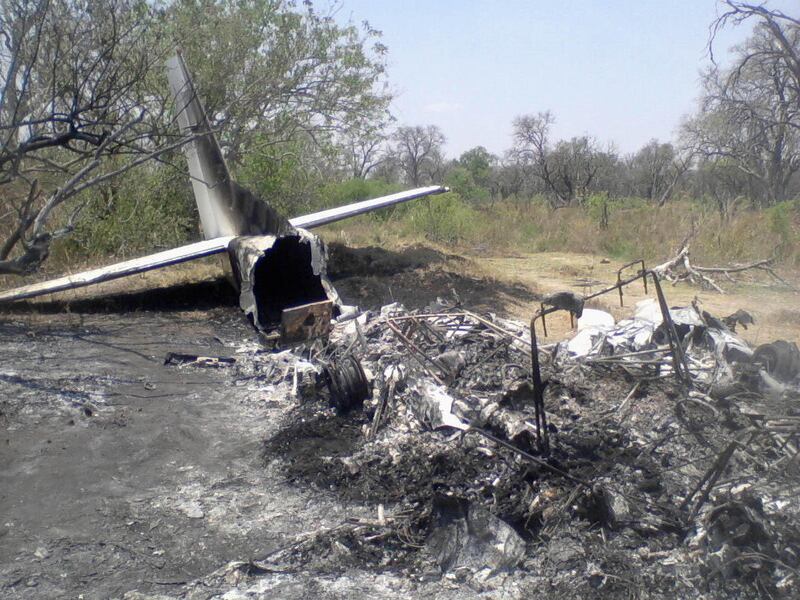In this photo taken Saturday, Oct. 15, 2011 the wreck of a crashed plane lays in the bush in the Okavango Delta. The light aircraft carrying 12 people crashed shortly after takeoff killing the British pilot and seven tourists from France, Switzerland and