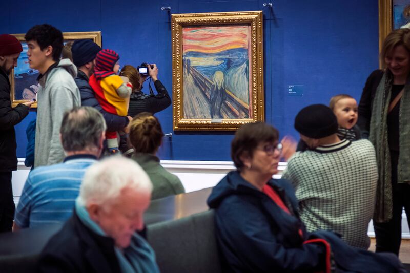 People look at Edvard Munch’s “The Scream” at the National Gallery in Oslo, Norway, Sunday Jan. 13, 2019. On Friday, Nov. 11, 2022, activists from the organization ‘’Stopp oljeletinga’’ (Stop Oil Exploration) tried to glue themselves to the frame of the painting.