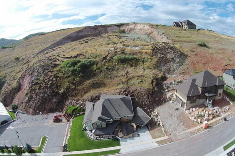 A home is destroyed by a landslide in North Salt Lake, Tuesday, Aug. 5, 2014.