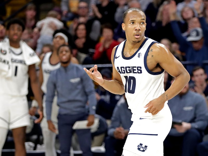 Utah State guard Darius Brown II celebrates after hitting a 3-pointer against East Tennessee State on Dec. 22, 2023, at the Spectrum in Logan. (Jeff Hunter)