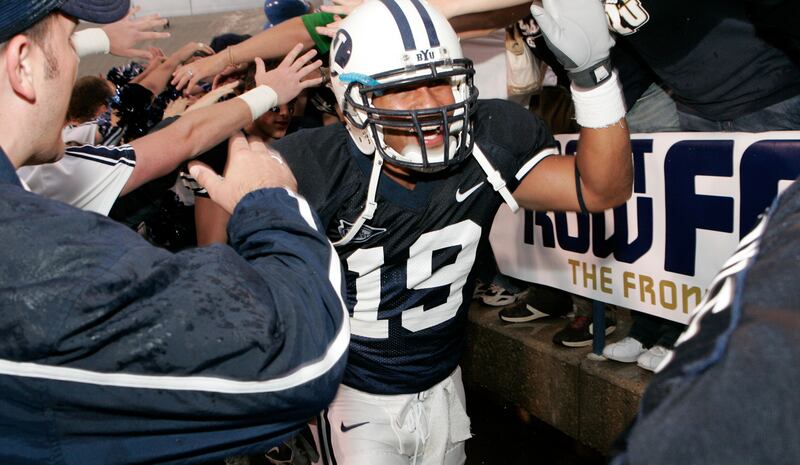 Former BYU player Zac Erekson takes the field prior to a game against Tulsa in Provo, Utah, at LaVell Edwards Stadium.