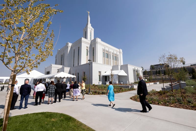 Tour guides attend a meeting as they prepare for an open house at the Pocatello Idaho Temple.