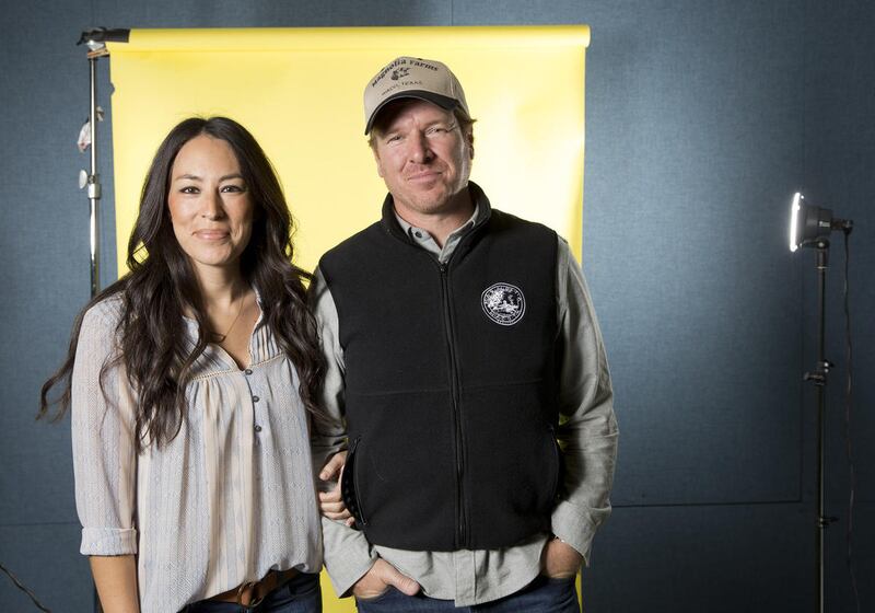 In this March 29, 2016 photo, Joanna Gaines, left, and Chip Gaines pose for a portrait in New York to promote their home improvement show, “Fixer Upper,” on HGTV.