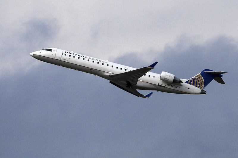 File - A United Airlines Express jet takes off from Pittsburgh International Airport, Wednesday, Feb. 22, 2017.
