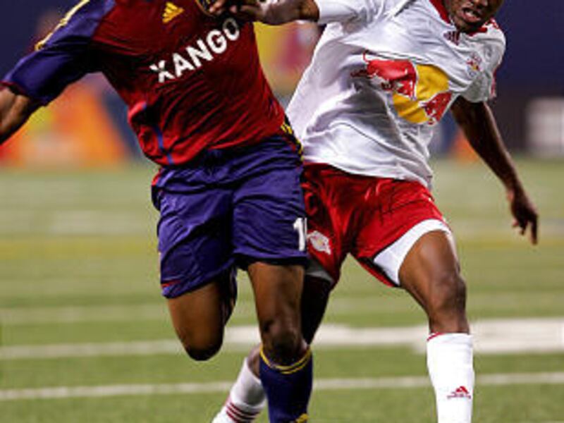 Real Salt Lake's Willis Forko and New York's Dane Richards struggle to control the ball Saturday in RSL's 2-2 tie with the Red Bulls.
