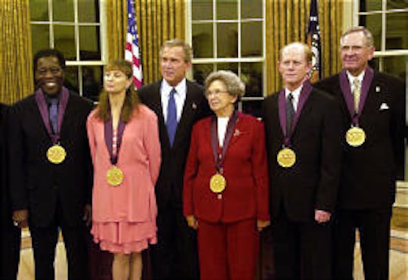 President Bush, back, stands with Mac Christensen, right, of the Tabernacle Choir, and fellow recipients Buddy Guy, left, Suzanne Farrell, Beverly Cleary, Ron Howard.