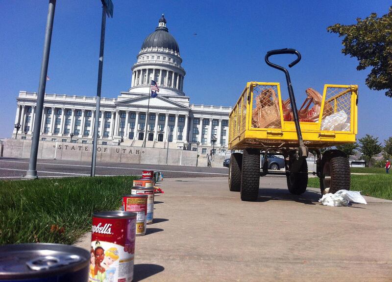 Utah Food Bank volunteers worked more than nine hours to place donated cans and boxed foods along State Street in Satl Lake City Thursday Sept. 20, 2012. Workers began as early as 5:45 a.m. for the Beating Hunger By a Mile campaign.