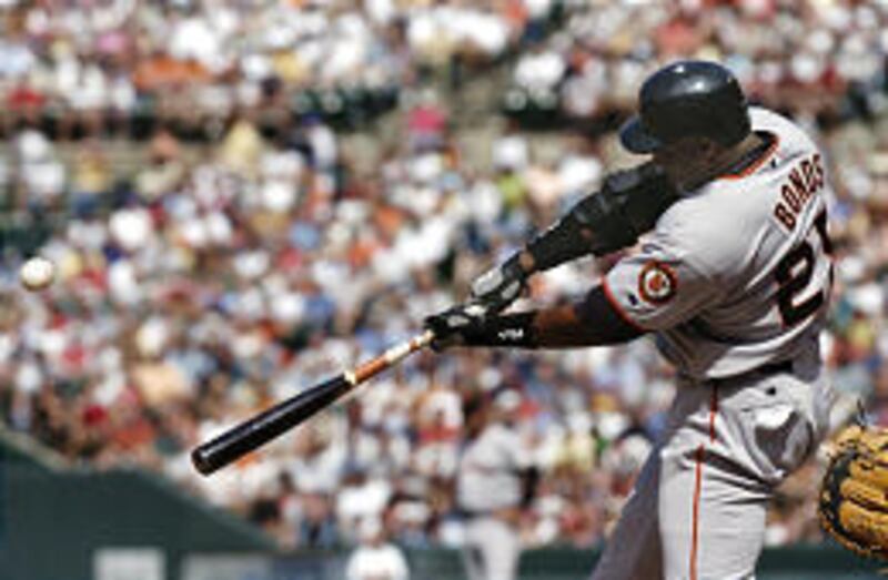 San Francisco Giants' slugger Barry Bonds connects for a solo home run off the Baltimore Orioles.