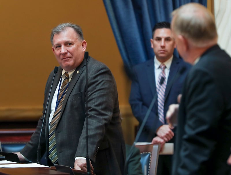 Sen. Curt Bramble, R-Provo, left, asks a question of Sen. Allen Christensen, R-North Ogden, sponsor of SB96, during discussion on the GOP leadership-backed replacement for the voter-approved Medicaid expansion ballot initiative at the Capitol in Salt Lake