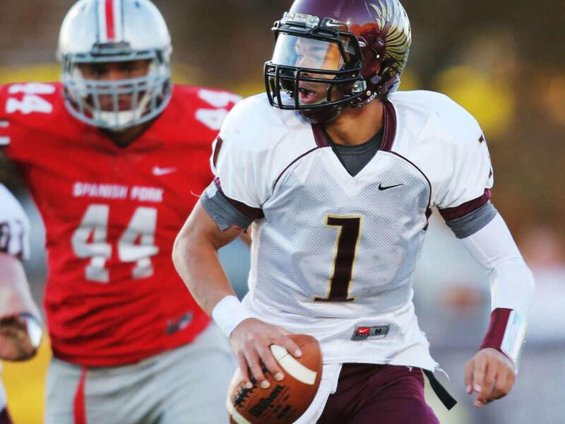 Maple Mountain's Jaren Hall looks for an open receiver as they play Spanish Fork Tuesday, Oct. 28, 2014, in the second half game at Provo High in the Region 8, 3 way play-in game.
