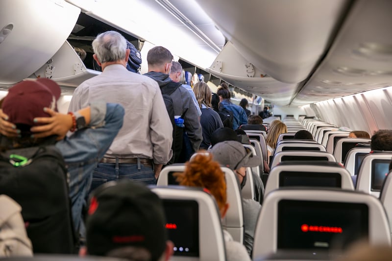 People exit an Air Canada after a flight at Toronto Pearson International Airport in Mississauga, Ontario, Canada.