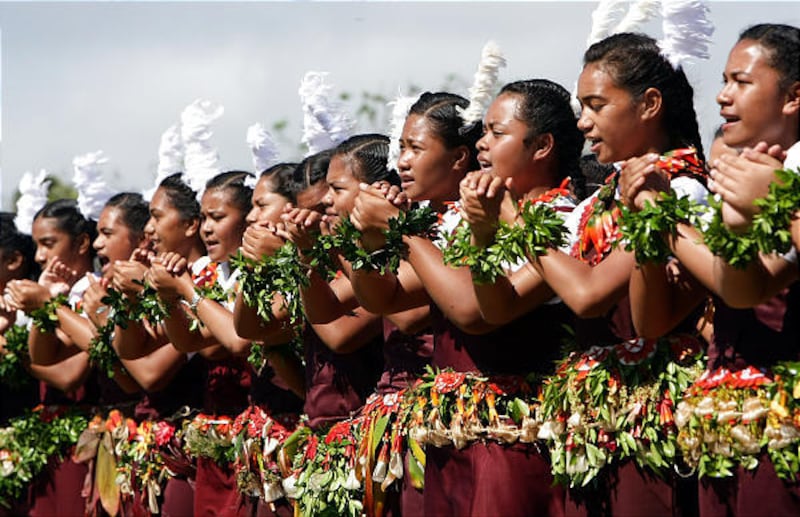 Tongan students perform the Lakalaka dance for King George Tupou V during Cultural Day celebrations in the capital, Nuku'alofa, Tuesday. The monarch will be formally installed as the 23rd ruler of the tiny South Pacific nation at a coronation ceremony on