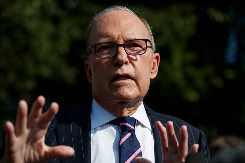 White House chief economic adviser Larry Kudlow talks with reporters outside the White House, Tuesday, Aug. 6, 2019, in Washington.